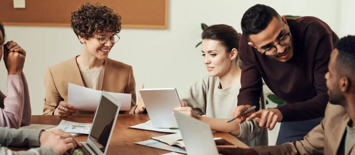 A leader delegating a taks during a meeting