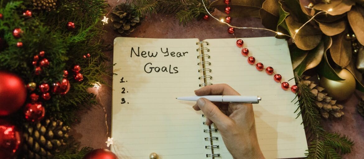Open notebook setting New year resolutions in a holidays setting